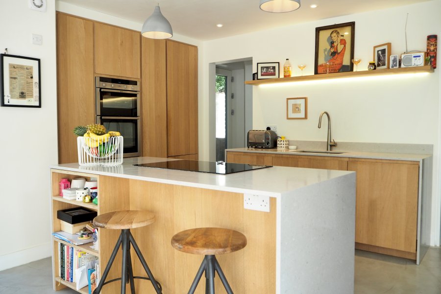 Solid wood modern handless kitchen with stone worktop