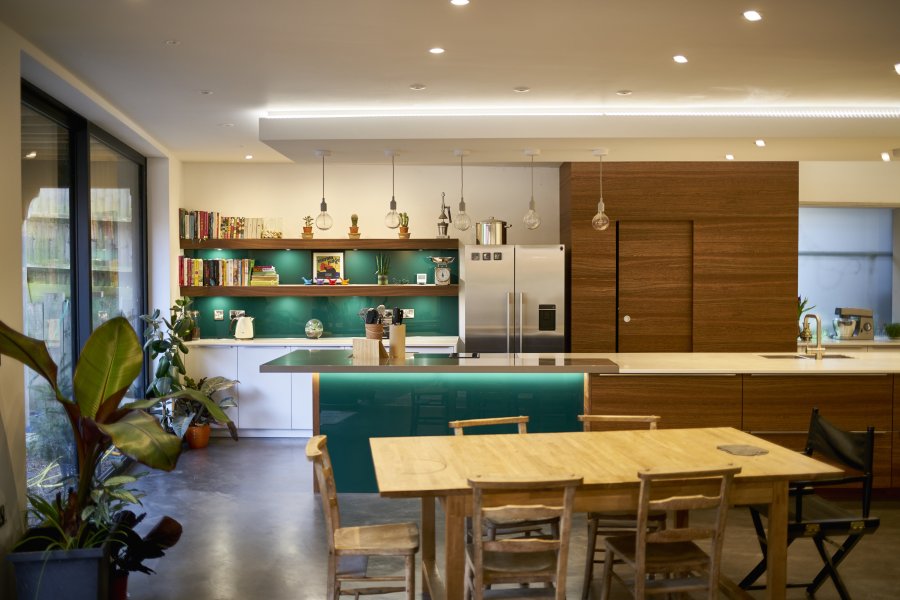 Stylish, contemporary kitchen with green glass accents