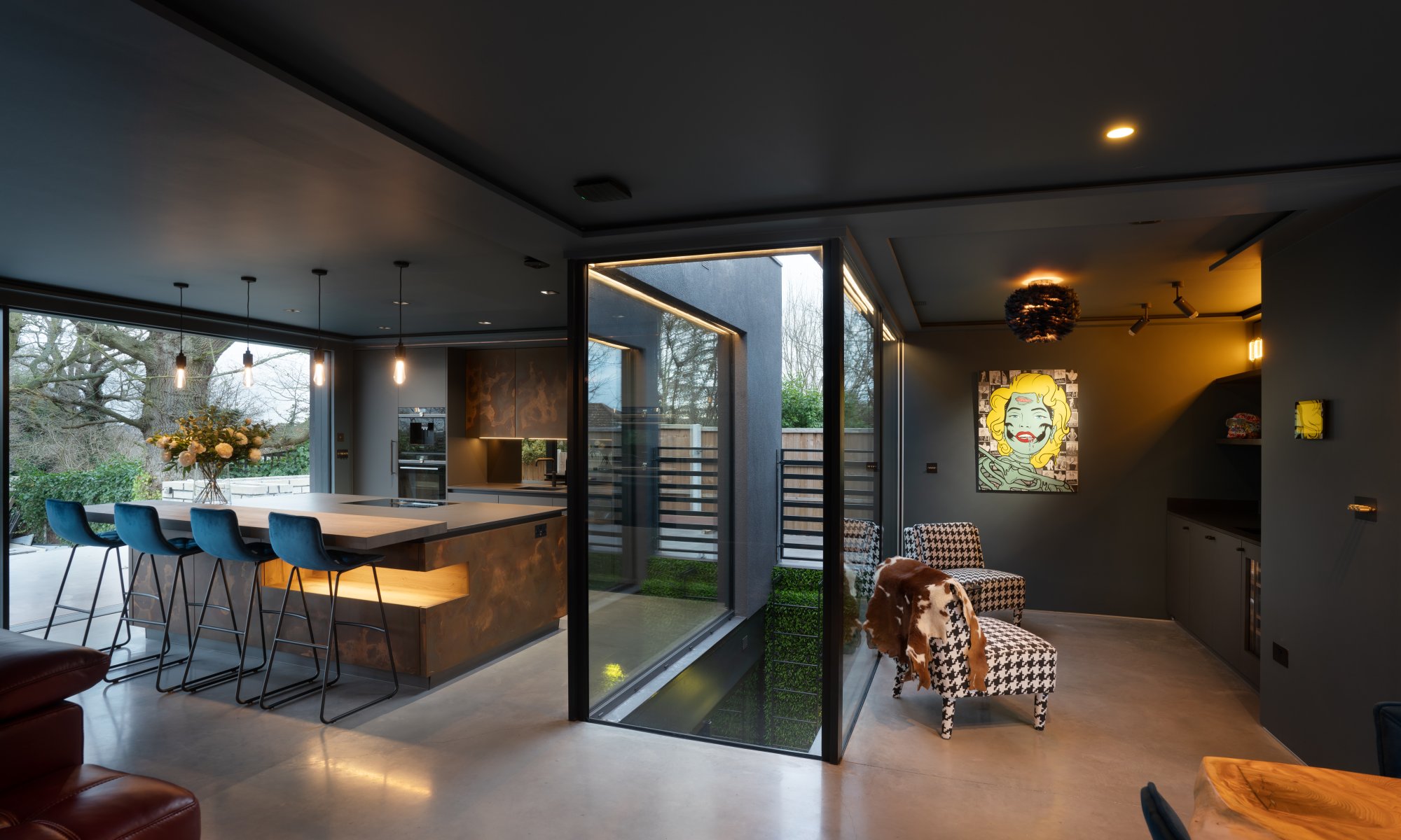 Open plan kitchen with copper modern kitchen and large island