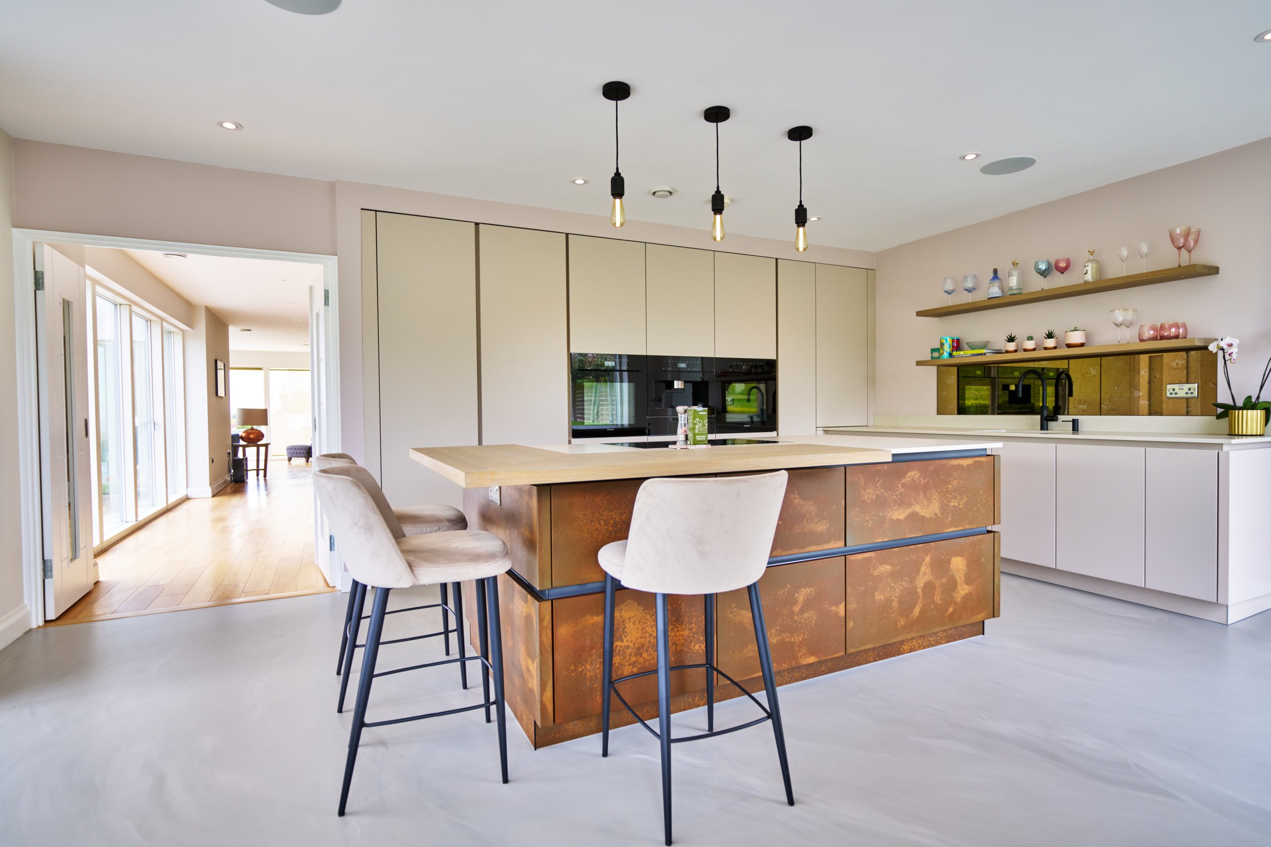 modernkitchenwithcopperdoorsandresinfloor