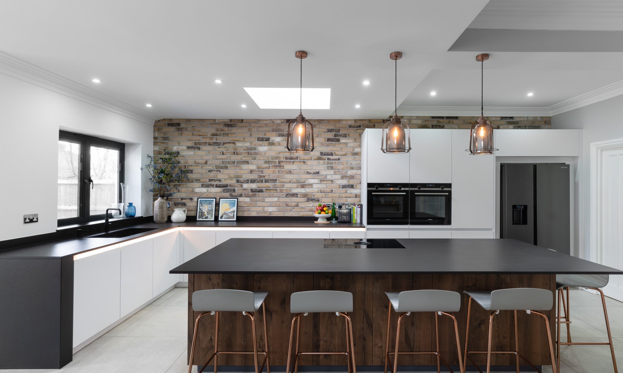 Modern kitchen with exposed brickwork and industrial details