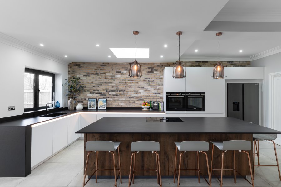 Modern kitchen with exposed brickwork and industrial details