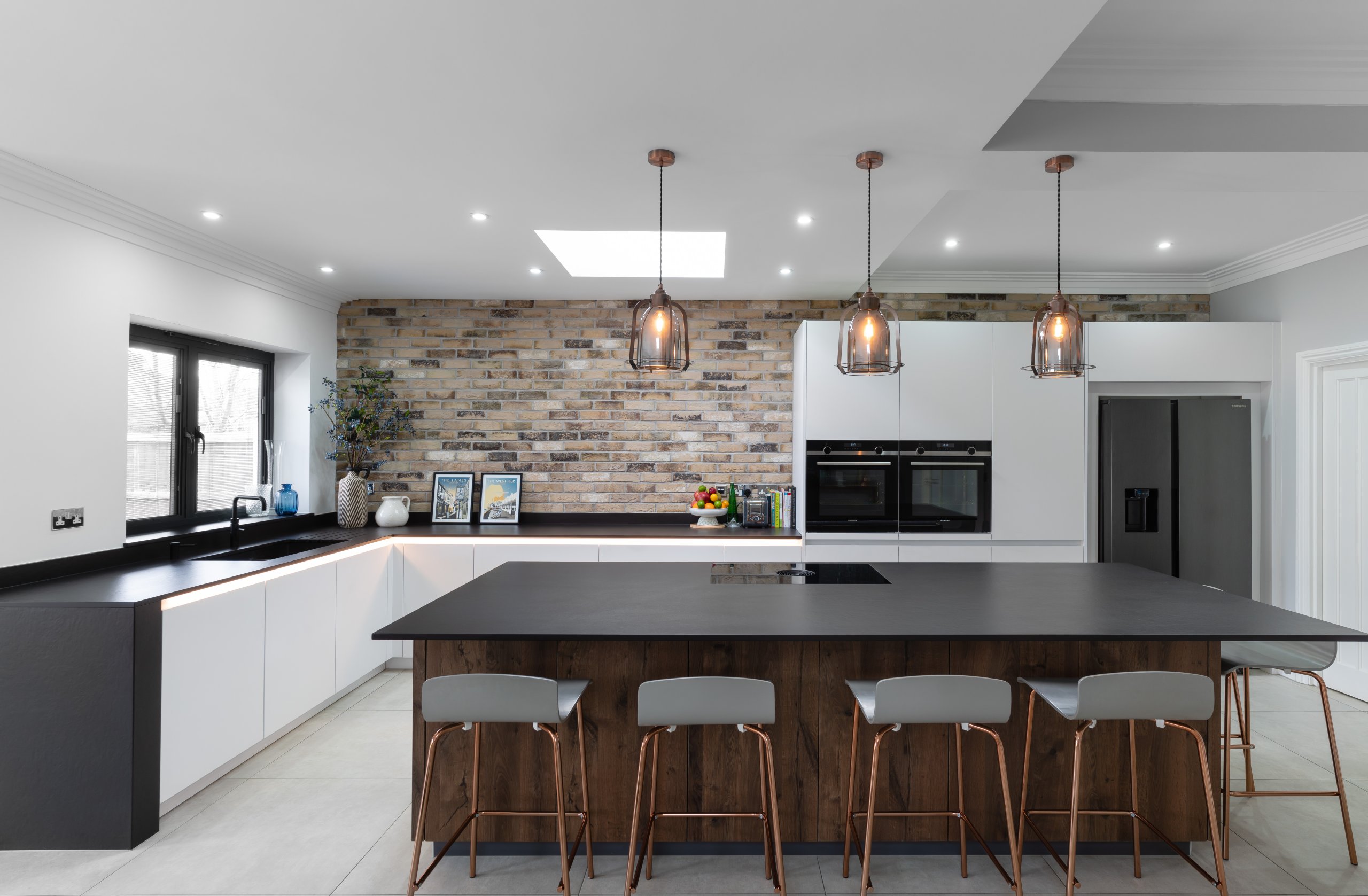 Modern kitchen with exposed brickwork and industrial details